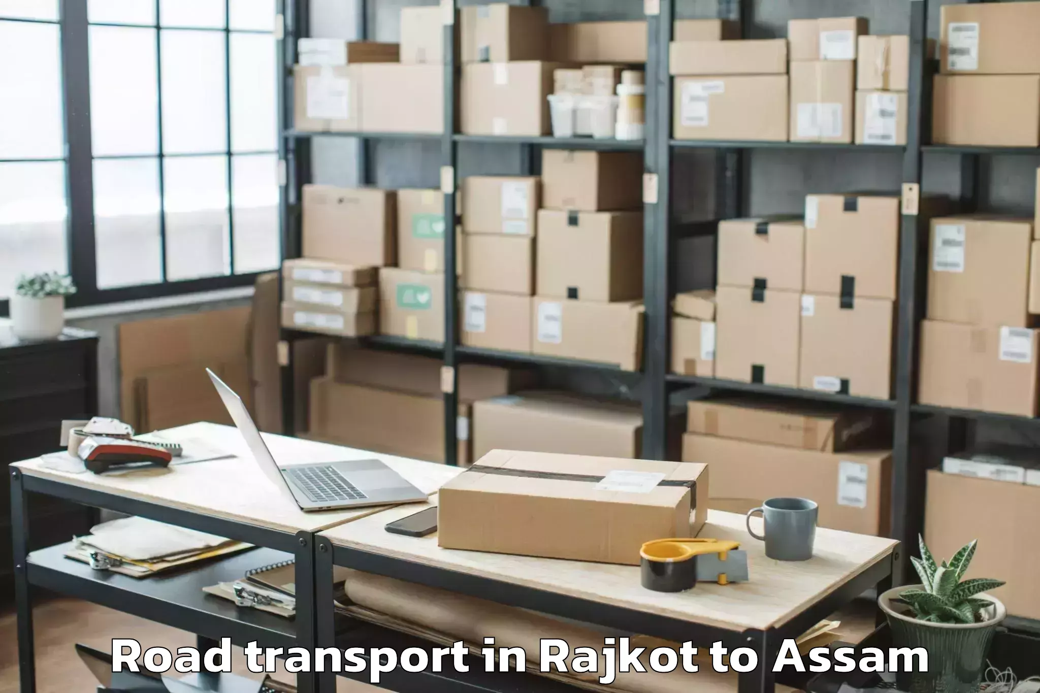 Affordable Rajkot to Raha Gaon Road Transport